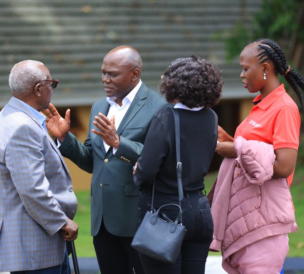 Fostering key corporate partnerships. Mr. Kakyomya engaging in a fruitful discussion with Mr. Kennedy Nyakomita and the Diamond Trust Bank (DTB) delegation during the event.